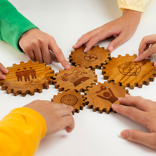Team putting jigsaw pieces together